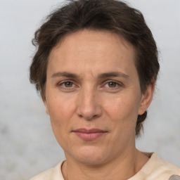 Joyful white adult female with short  brown hair and brown eyes