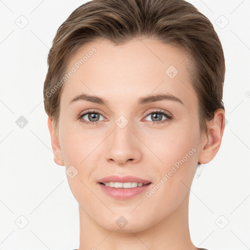 Joyful white young-adult female with short  brown hair and grey eyes