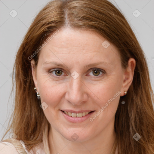 Joyful white adult female with long  brown hair and brown eyes