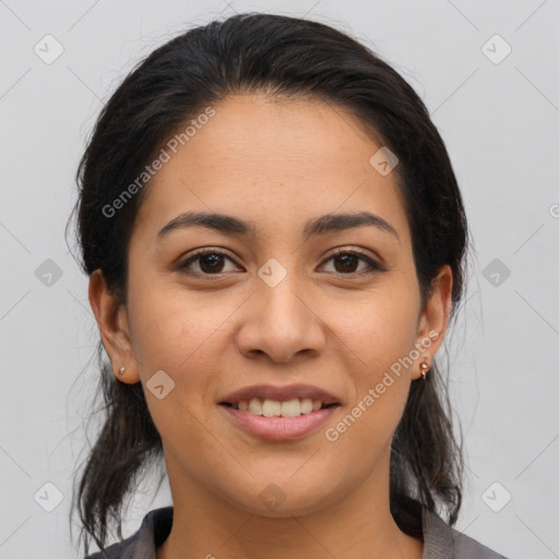 Joyful latino young-adult female with medium  brown hair and brown eyes