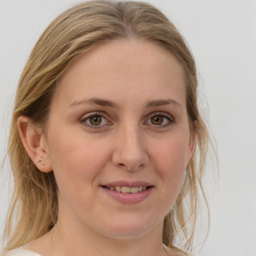 Joyful white young-adult female with medium  brown hair and grey eyes