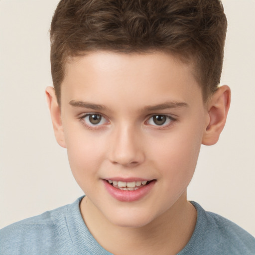 Joyful white child male with short  brown hair and brown eyes