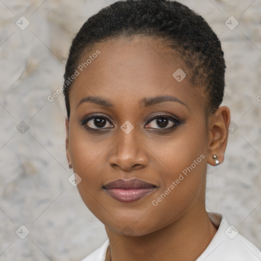 Joyful black young-adult female with short  brown hair and brown eyes