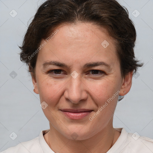 Joyful white adult female with short  brown hair and brown eyes