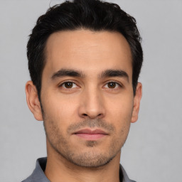 Neutral white young-adult male with short  black hair and brown eyes