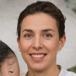 Joyful white adult female with short  brown hair and brown eyes