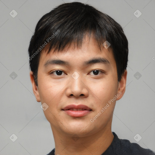 Joyful asian young-adult male with short  black hair and brown eyes