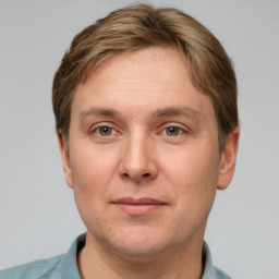 Joyful white adult male with short  brown hair and grey eyes