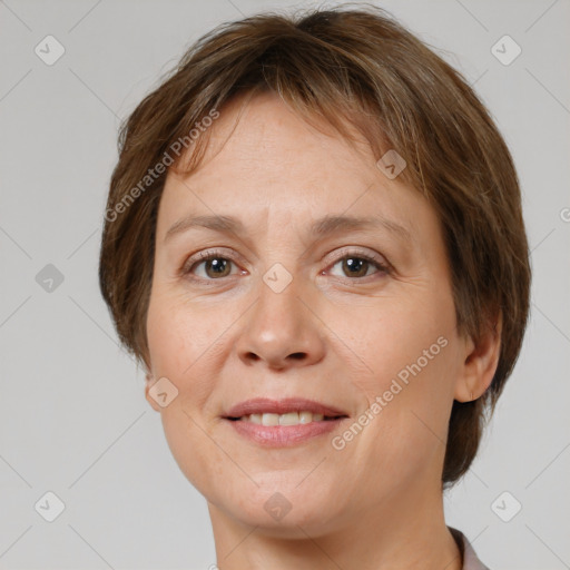 Joyful white adult female with short  brown hair and brown eyes