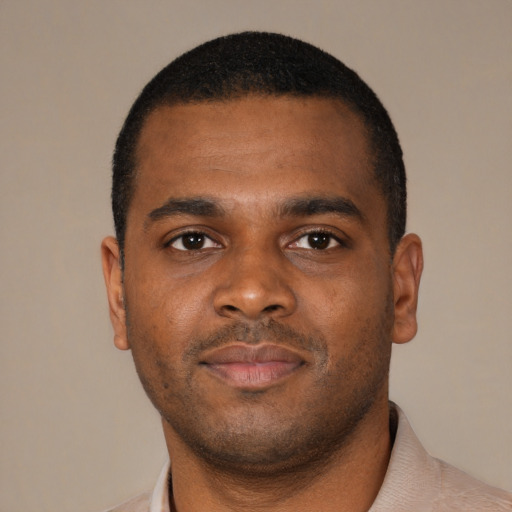 Neutral black young-adult male with short  black hair and brown eyes