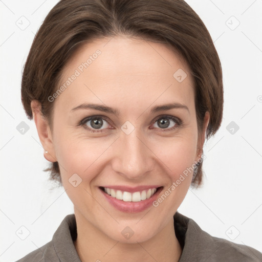 Joyful white young-adult female with medium  brown hair and grey eyes