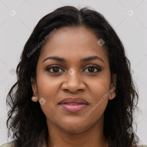 Joyful black young-adult female with long  brown hair and brown eyes