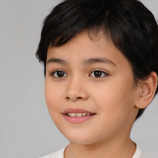 Joyful white child female with medium  brown hair and brown eyes