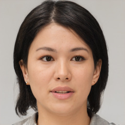 Neutral asian young-adult female with medium  brown hair and brown eyes