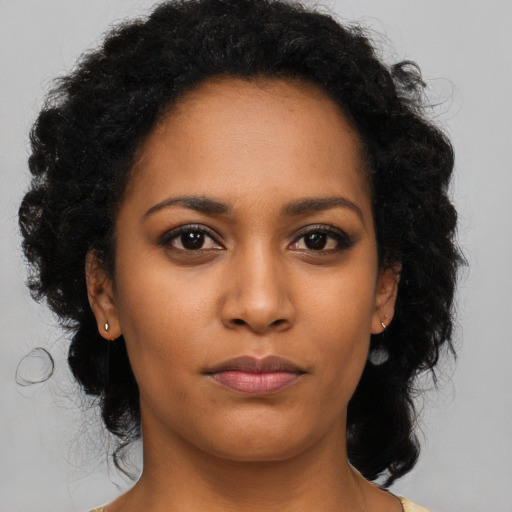 Neutral black young-adult female with long  black hair and brown eyes