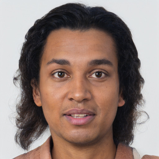 Neutral black young-adult male with long  brown hair and brown eyes