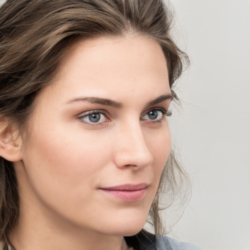 Neutral white young-adult female with medium  brown hair and grey eyes