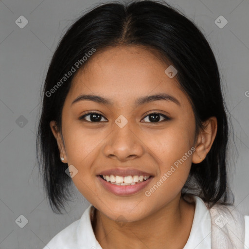 Joyful latino young-adult female with medium  brown hair and brown eyes