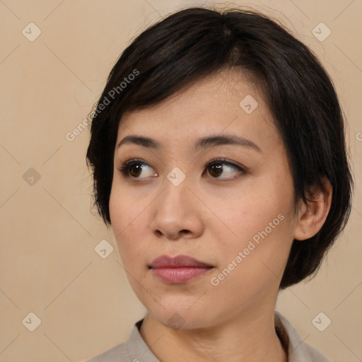 Neutral asian young-adult female with medium  brown hair and brown eyes