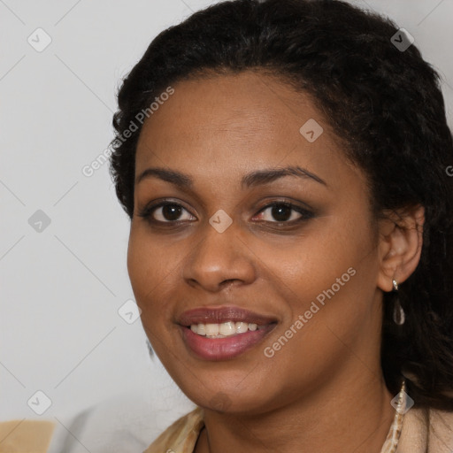 Joyful black young-adult female with long  black hair and brown eyes