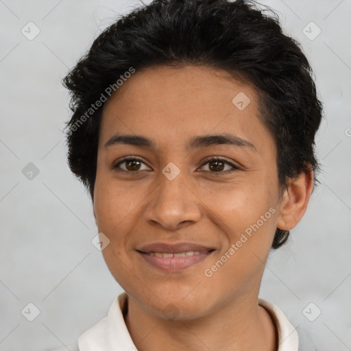 Joyful latino young-adult female with short  brown hair and brown eyes