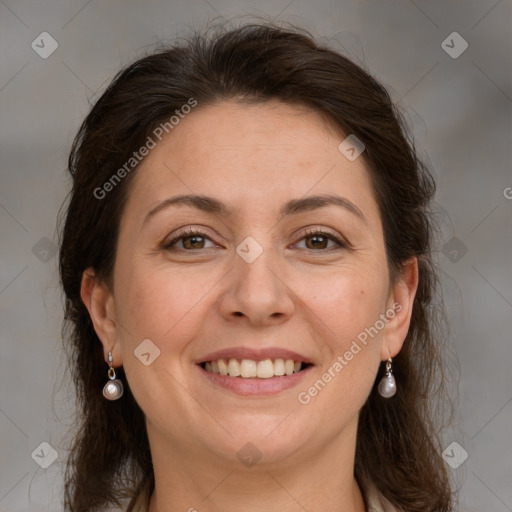 Joyful white adult female with medium  brown hair and grey eyes