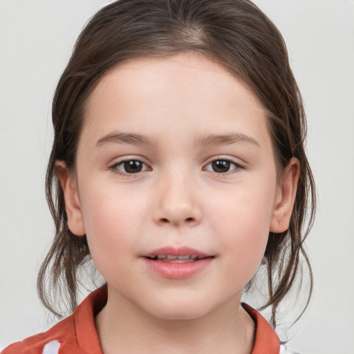 Joyful white child female with medium  brown hair and grey eyes