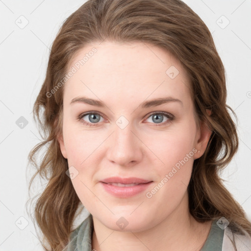 Joyful white young-adult female with medium  brown hair and blue eyes