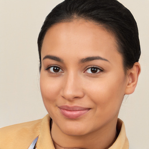 Joyful latino young-adult female with medium  brown hair and brown eyes