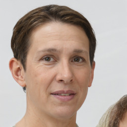 Joyful white adult female with short  brown hair and brown eyes