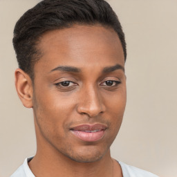 Joyful black young-adult male with short  brown hair and brown eyes