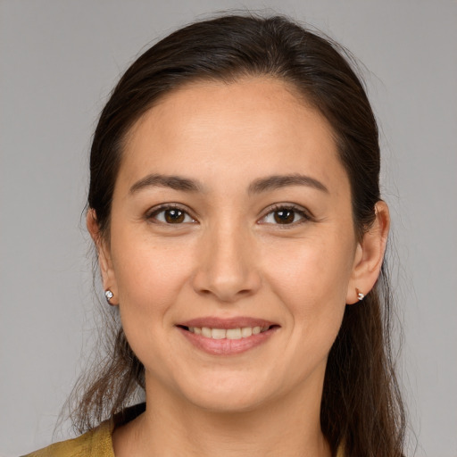 Joyful white young-adult female with medium  brown hair and brown eyes