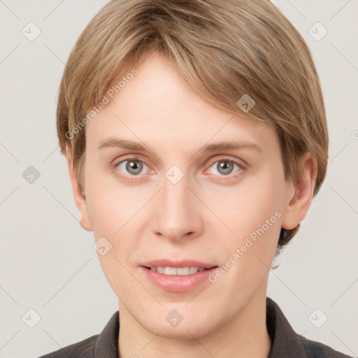 Joyful white young-adult female with short  brown hair and grey eyes