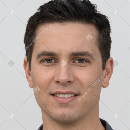 Joyful white young-adult male with short  brown hair and brown eyes