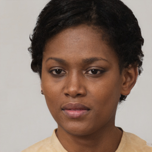 Neutral black young-adult female with short  brown hair and brown eyes