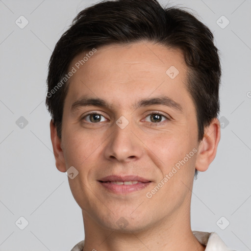 Joyful white young-adult male with short  brown hair and brown eyes