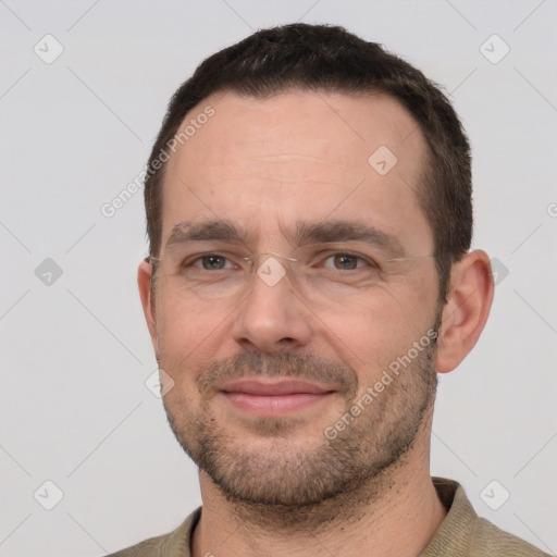 Joyful white adult male with short  brown hair and brown eyes