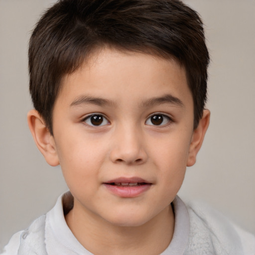 Joyful white child male with short  brown hair and brown eyes