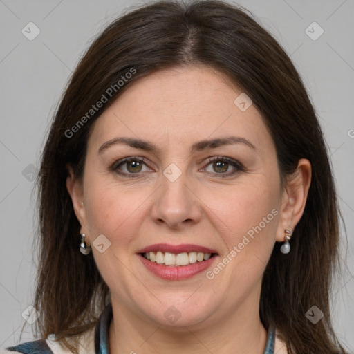 Joyful white adult female with medium  brown hair and grey eyes