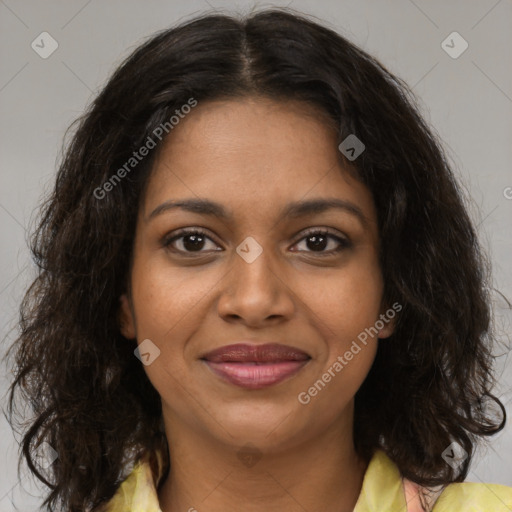 Joyful black young-adult female with medium  brown hair and brown eyes