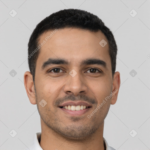 Joyful latino young-adult male with short  black hair and brown eyes