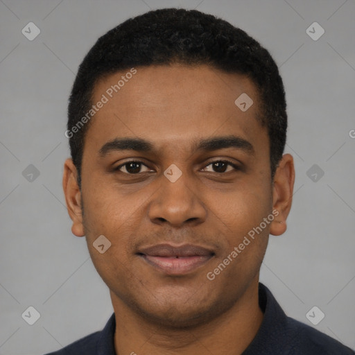 Joyful black young-adult male with short  black hair and brown eyes