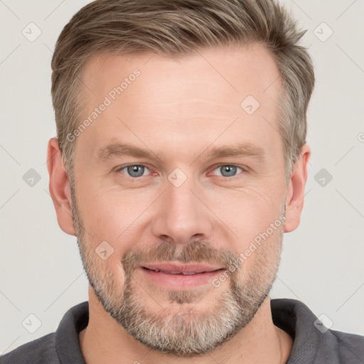 Joyful white adult male with short  brown hair and grey eyes