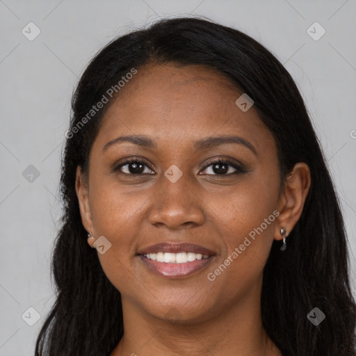 Joyful black young-adult female with long  brown hair and brown eyes