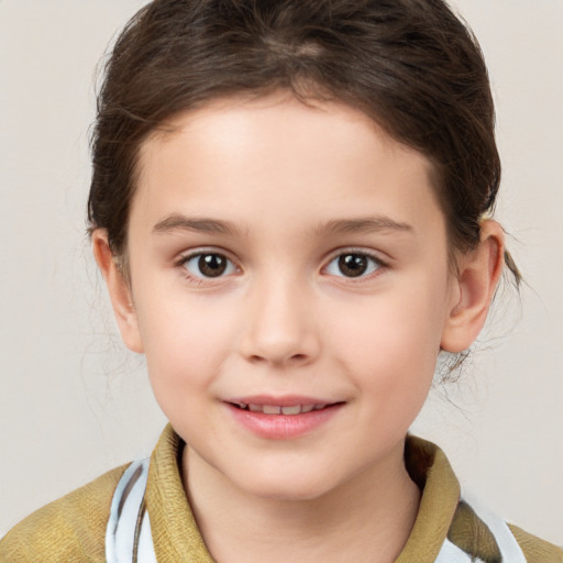 Joyful white child female with short  brown hair and brown eyes