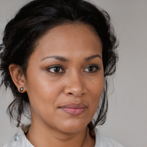 Joyful black young-adult female with medium  brown hair and brown eyes