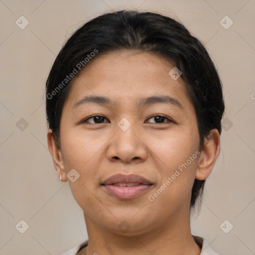 Joyful asian adult female with short  brown hair and brown eyes