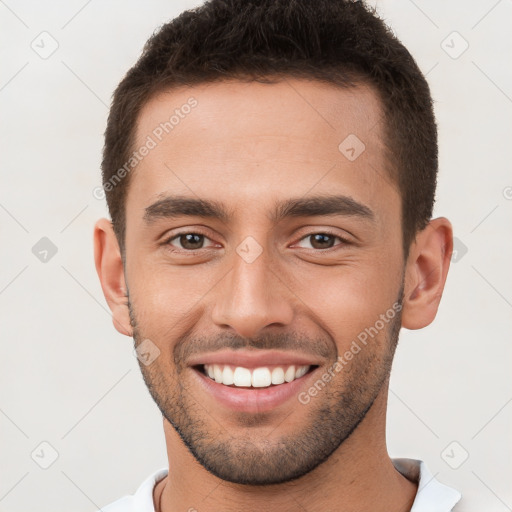 Joyful white young-adult male with short  brown hair and brown eyes