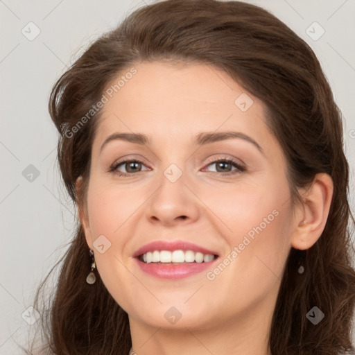 Joyful white young-adult female with long  brown hair and green eyes