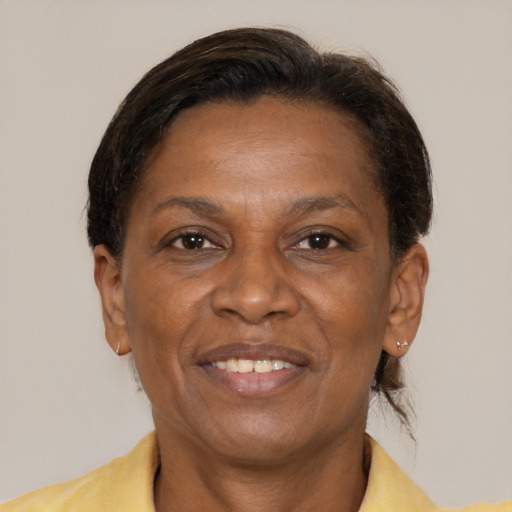Joyful latino adult female with short  brown hair and brown eyes